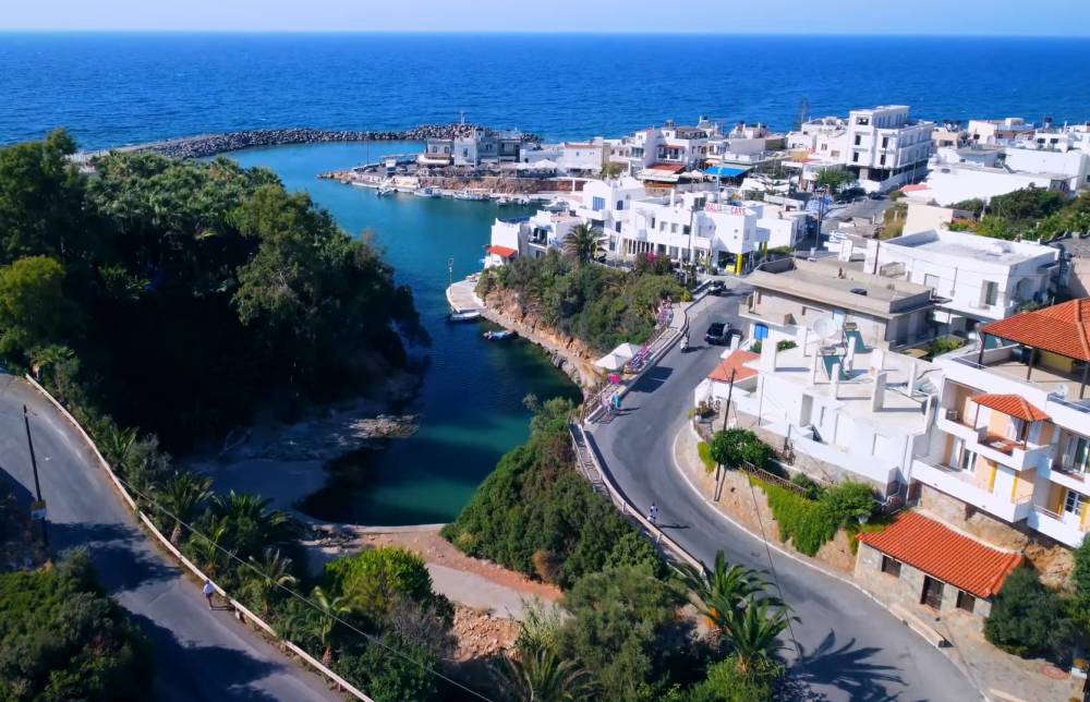 Aerial view of Sissi, Crete, featuring the picturesque coastline, charming village, and surrounding landscape | Smart Car Rental